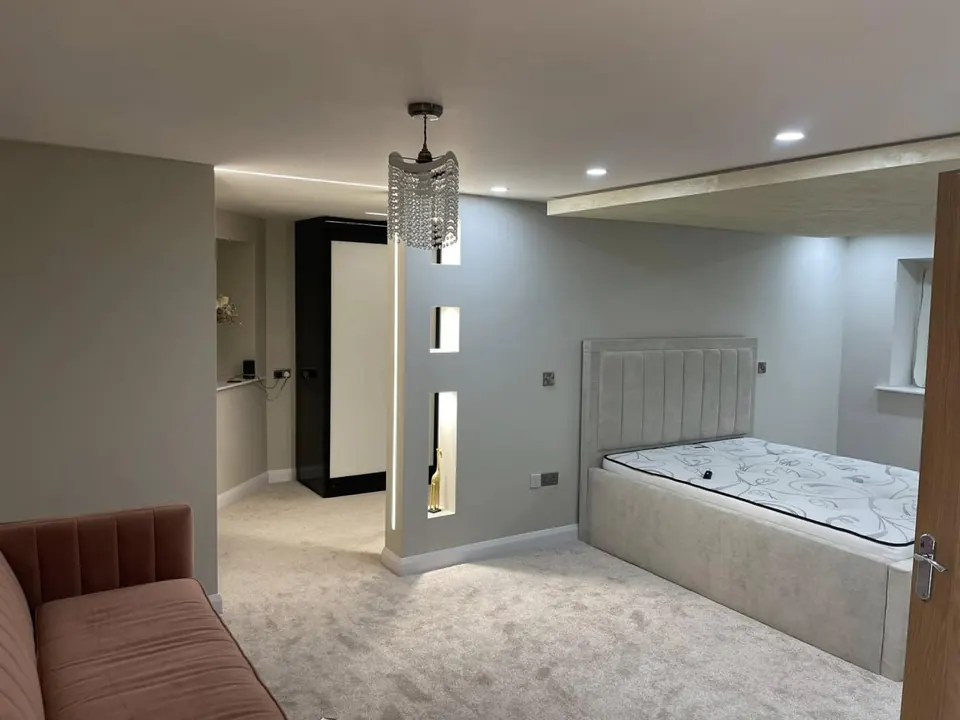 Dimmable LED downlights and switched sockets fitted in a Sheffield bedroom