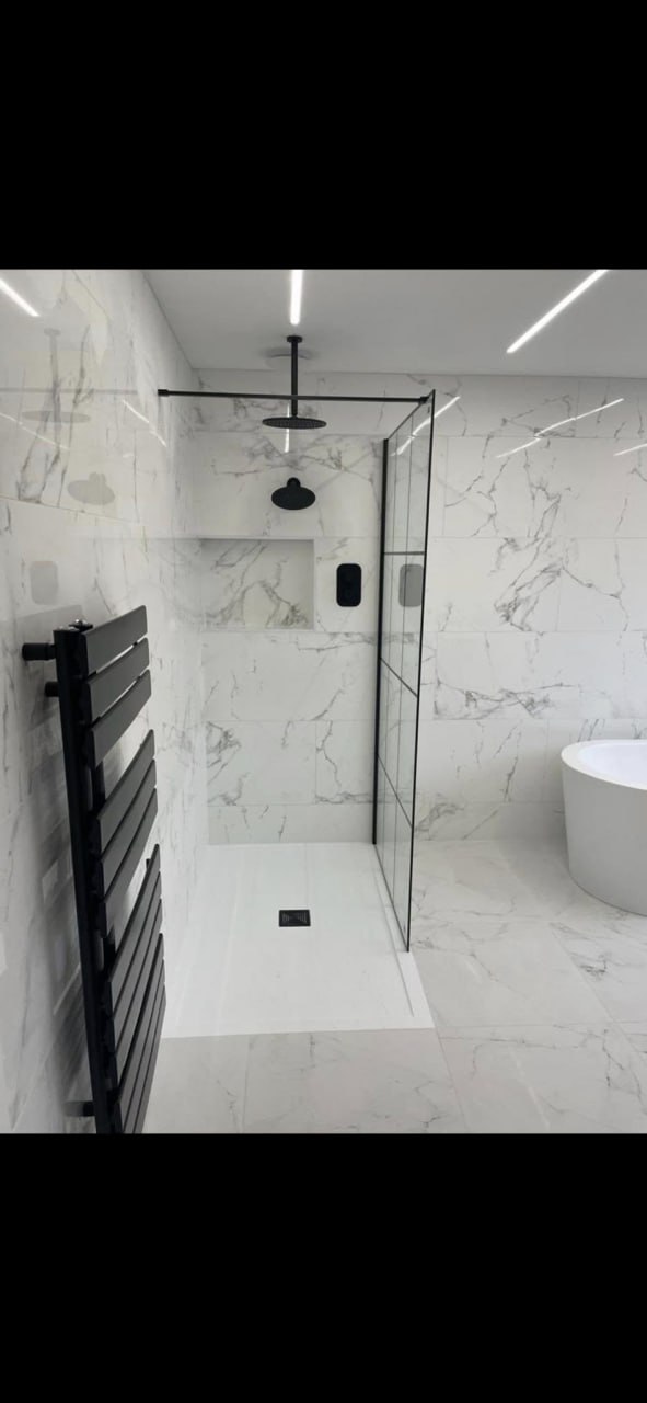 IP-rated wet room downlights and shaver socket wiring by a NAPIT electrician in Sheffield
