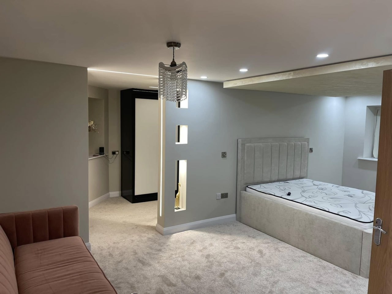 Bedroom lighting installation in Sheffield with dimmable LED downlights and switched sockets