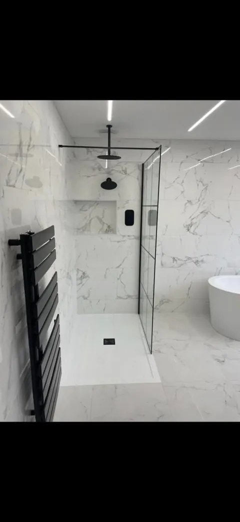 IP-rated wet room downlights and shaver socket wiring by a NAPIT electrician in Sheffield